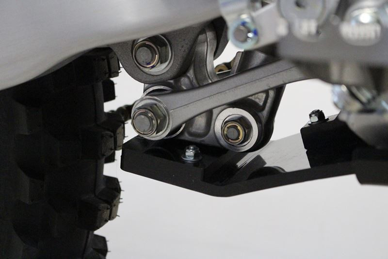 Close up view of the linkage guard of the black HDPE plastic skid plate for Yamaha YZ250F - YZ450F