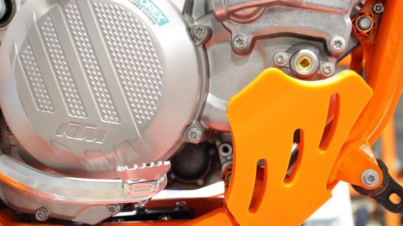 Close up view of the cases protection of the orange HDPE plastic skid plate for KTM 250 - 300 2T